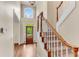 Grand foyer with hardwood floors, a staircase, and a decorative chandelier at 486 Milledge Gate Se Ter, Marietta, GA 30067