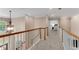 Upstairs hallway overlooking living room featuring a bedroom view and natural lighting at 486 Milledge Gate Se Ter, Marietta, GA 30067