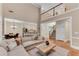 Open-concept living space with fireplace and backyard view with easy access to the kitchen at 486 Milledge Gate Se Ter, Marietta, GA 30067