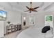 This primary bedroom has neutral decor, carpeted floors and a ceiling fan at 486 Milledge Gate Se Ter, Marietta, GA 30067
