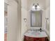 Elegant powder room features a marble countertop vanity and decorative mirror and lighting at 486 Milledge Gate Se Ter, Marietta, GA 30067