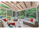 Inviting sunroom with tile flooring, skylights, and comfortable seating, surrounded by lush greenery at 486 Milledge Gate Se Ter, Marietta, GA 30067