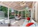 Relaxing sunroom with ample seating, skylights, and views of the landscaped backyard at 486 Milledge Gate Se Ter, Marietta, GA 30067