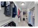 A well-organized walk-in closet with custom shelving and hanging rods for clothes and accessories at 486 Milledge Gate Se Ter, Marietta, GA 30067