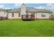 Well-manicured backyard and deck area, perfect for outdoor gatherings at 5525 Mayfair Crossing Dr, Lithonia, GA 30038
