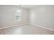 Clean bedroom with hard surface floors and a bright window that provides natural light at 5525 Mayfair Crossing Dr, Lithonia, GA 30038