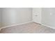 A bedroom with gray walls, hard floors, and a closet at 5525 Mayfair Crossing Dr, Lithonia, GA 30038