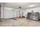 A spacious two car garage with automatic door and concrete floors at 5525 Mayfair Crossing Dr, Lithonia, GA 30038