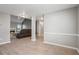 Open-concept living room featuring hard floors, a fireplace, and natural light at 5525 Mayfair Crossing Dr, Lithonia, GA 30038