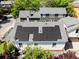 Aerial view of a home with installed solar panels on the roof, surrounded by lush greenery in a desirable neighborhood at 69 Randolph Ne St, Atlanta, GA 30312
