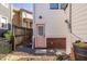 Exterior back door, leading to gravel area, and surrounded by fencing and garden features at 69 Randolph Ne St, Atlanta, GA 30312