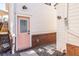 Exterior back door framed by brickwork, leading to gravel area, and surrounded by modern features at 69 Randolph Ne St, Atlanta, GA 30312