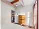 Well-lit bedroom features hardwood floors, natural wood accents, and access to an ensuite bath at 69 Randolph Ne St, Atlanta, GA 30312