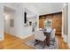 Open-concept dining area with hardwood floors, modern lighting, and ample space for entertaining at 69 Randolph Ne St, Atlanta, GA 30312