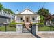Charming cottage-style home featuring a well-manicured front yard with beautiful landscaping and brick-accented porch at 69 Randolph Ne St, Atlanta, GA 30312