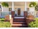 Charming front porch featuring brick steps, decorative plants, and views of a well-manicured front yard at 69 Randolph Ne St, Atlanta, GA 30312