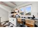 Charming eat-in kitchen features a unique black and white tile floor, white cabinetry and stainless steel appliances at 69 Randolph Ne St, Atlanta, GA 30312
