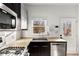 Bright kitchen featuring stainless steel appliances, granite countertops, and a window over the sink at 69 Randolph Ne St, Atlanta, GA 30312