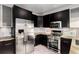 Modern kitchen featuring stainless steel appliances, granite countertops, and stylish cabinetry at 69 Randolph Ne St, Atlanta, GA 30312