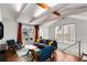 Bright living room featuring exposed wooden beams, hardwood floors, and stylish furnishings at 69 Randolph Ne St, Atlanta, GA 30312