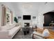 Bright and airy living room with vaulted ceilings, a fireplace, and open access to an office at 69 Randolph Ne St, Atlanta, GA 30312