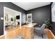 Well-lit office features hardwood floors, neutral paint, and open access to living room at 69 Randolph Ne St, Atlanta, GA 30312