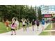 Outdoor recreation area with roller skaters and walkers enjoying the paved path and green spaces at 69 Randolph Ne St, Atlanta, GA 30312