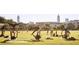 People enjoying acroyoga in a park setting with the city skyline visible in the background at 69 Randolph Ne St, Atlanta, GA 30312