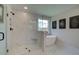 Modern bathroom with a soaking tub, a frameless glass shower with marble-look tile, and tiled floors at 110 Prescott Manor Dr, Canton, GA 30115