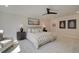 Cozy main bedroom suite with an elegant ceiling fan and soft, neutral decor at 110 Prescott Manor Dr, Canton, GA 30115