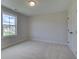 Bedroom filled with natural light featuring double door closet and nice backyard views at 110 Prescott Manor Dr, Canton, GA 30115