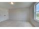 Bright bedroom featuring neutral carpet, a double door closet, and a window with natural light at 110 Prescott Manor Dr, Canton, GA 30115
