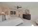 A spacious main bedroom suite features a ceiling fan, large dresser, and soft, neutral decor at 110 Prescott Manor Dr, Canton, GA 30115