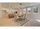 Open floorplan showcasing an eat-in kitchen and formal dining area with backyard views at 110 Prescott Manor Dr, Canton, GA 30115