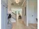 Open foyer with hardwood floors, a staircase with black iron railing, and view of living room at 110 Prescott Manor Dr, Canton, GA 30115