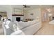 Spacious living room featuring a white brick fireplace, comfortable seating, and an open layout perfect for entertaining at 110 Prescott Manor Dr, Canton, GA 30115