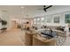 Open concept living room with hardwood floors, a view of the kitchen, and large windows at 110 Prescott Manor Dr, Canton, GA 30115