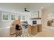 Bright living room with fireplace, light hardwood floors, and large windows with backyard views at 110 Prescott Manor Dr, Canton, GA 30115