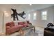 Upstairs sitting area with modern decor, stylish accent pieces, and three large windows at 110 Prescott Manor Dr, Canton, GA 30115