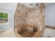 Bathroom showcases a tiled shower with built in bench and a window at 1212 Lee Whatley Dr, Lithonia, GA 30058