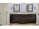 Bathroom features dual sinks, dark wood cabinetry, and granite counters at 1212 Lee Whatley Dr, Lithonia, GA 30058