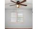 A bedroom with a ceiling fan and a window view at 1212 Lee Whatley Dr, Lithonia, GA 30058
