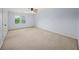 Bedroom with carpet flooring, a ceiling fan, a window and white walls at 1212 Lee Whatley Dr, Lithonia, GA 30058