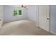 Bedroom with carpet, light blue walls, ceiling fan and a double door closet at 1212 Lee Whatley Dr, Lithonia, GA 30058