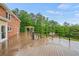 Expansive outdoor deck with railings, gazebo, and a view of the lush green surroundings at 1212 Lee Whatley Dr, Lithonia, GA 30058
