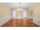 Dining room with hardwood floors, crown molding, and natural light from two windows at 1212 Lee Whatley Dr, Lithonia, GA 30058