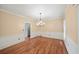 Dining room with hardwood floors, crown molding, and natural light from window at 1212 Lee Whatley Dr, Lithonia, GA 30058