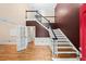 Elegant foyer with hardwood floors, staircase, and view into an office at 1212 Lee Whatley Dr, Lithonia, GA 30058