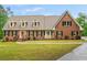 Charming brick home exterior with manicured lawn and a welcoming front entrance at 1212 Lee Whatley Dr, Lithonia, GA 30058