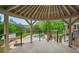 Gazebo with a view of the pool, jacuzzi, and outdoor seating at 1212 Lee Whatley Dr, Lithonia, GA 30058